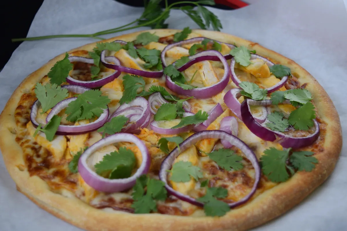 BBQ chicken pizza - BBQ chicken, red onion and cilantro